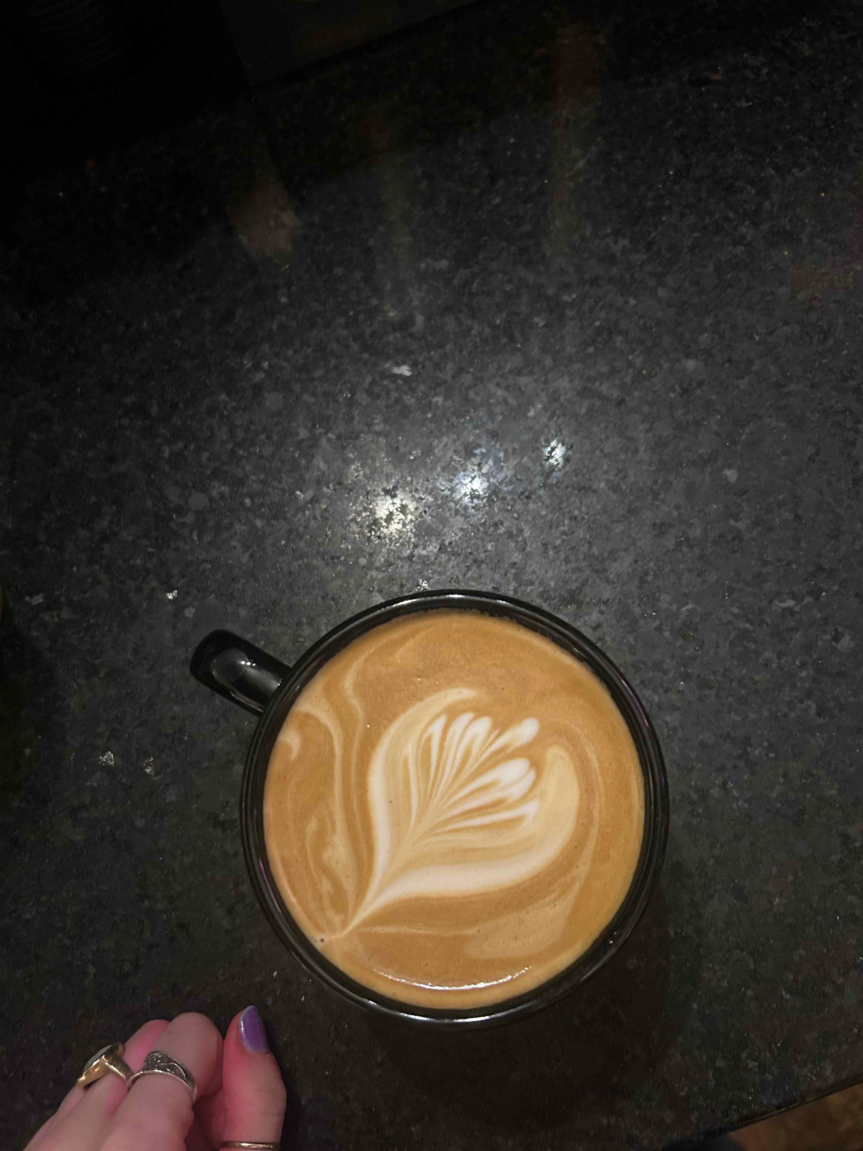 Latte with a layered tulip poured into the foam